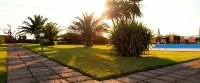 Apartments with pool and garden a short distance from the beach.