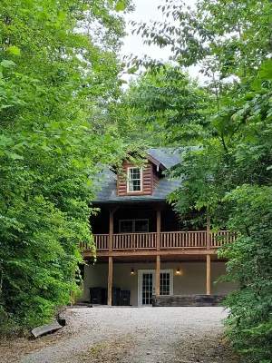 Secluded cozy cabin nestled among the hemlocks and rock formations in Hocking