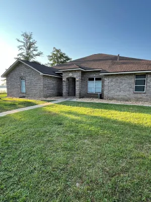 Enjoy this waterfront home with a pool, dock, and Blue Angels! Bring your boat!