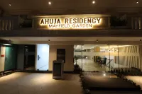 Ahuja Residency Mayfield Garden Hotels near Gurugram University