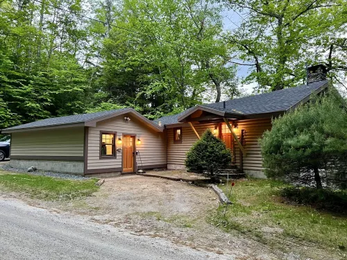 Lakefront cabin with dock, hot tub, fire pit!!
