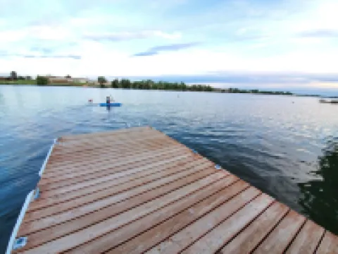 Lakefront Getaway. Private Waterfront Home with Dock and Sunroom.