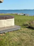 Oceanfront cabin with private beach and hot tub