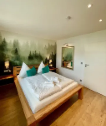 Cozy 5 star apartment with a dream view. Hiking trails and bathing lake nearby.