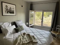 Provencal farmhouse on a hillside surrounded by centuries-old olive and oak trees