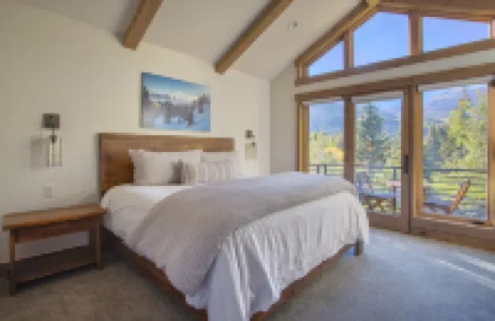 Dreamy home on river, mountain views, steps from town.