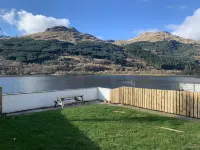 Situated in Lomond Park on the shore of Loch Long with amazing views