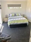 Brand New 3 Bedroom Beachfront Getaway.  Beach just across the road.