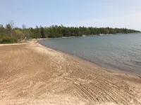 Updated cabin sleeps 8. Pet friendly, and has private neighborhood beach. Hotels in Charlevoix Township