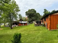 Welcome to Shangri-Lodge Your 2 cabin retreat on a family friendly lake.