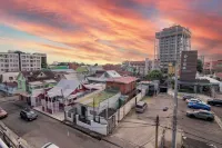 Prime Location + Rooftop Access + City Views + Queens Park Savannah + Walkable