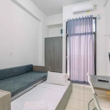 Minimalist and Comfortable Studio Dave Apartment by Travelio