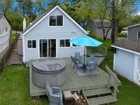 Beautiful 4-bedroom  Lake Front Cottage with HOT TUB & rentable BOAT