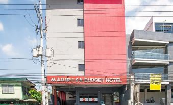 There is a building in Kuala Lumpur that has a front entrance to an art museum at Moda Mariposa Budget Hotel - Anonas