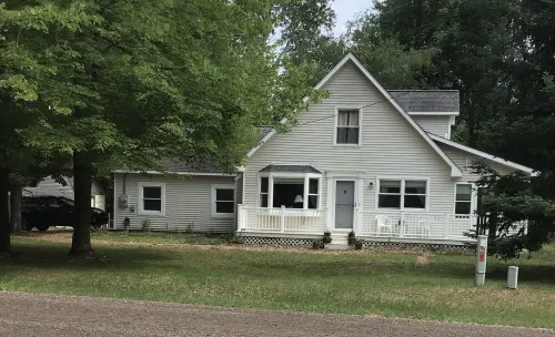 Roomy home with spacious fenced in backyard and fire pit.