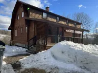 Log  cabin on Macintosh Pond access to VAST trail system snowmobile trails.