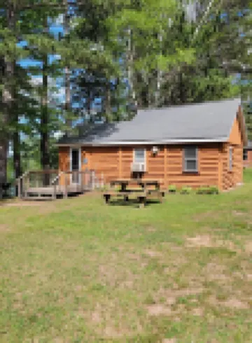 Rustic cabin getaway on the shore of Soo Lake in Phillips, WI