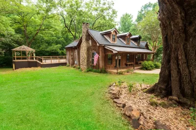 Vintage charm meets modern comfort in this historic 1850s cabin at Lake Hartwell