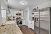 Home with pool, games and relaxation, in the middle of it all!