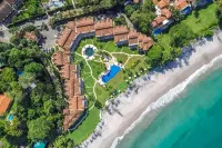 Modern Oceanfront Condo with a Chic Coastal Design, Resort-Style Amenities, and Direct Beach Access