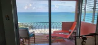 Caribbean Breeze Condo - hilltop breezes, views, convenience to beach & more!