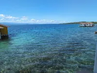 Charming bungalow over a coral reef in the Caribbean sea with stunning sunsets!