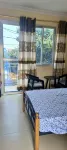 Cozy Guest Room in Kinshasa with Balcony and Partial Air-Conditioning