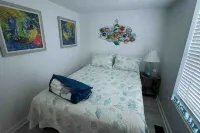 Charming Beach Cottage with Outdoor Shower and Golf Cart - Delightful Escape