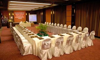 a conference room set up for a meeting , with chairs arranged in a semicircle around a table at Kuiburi Hotel & Resort