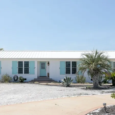 Beautiful Beach Home- 3 min walk to beach-Boat dock in back yard & private pool