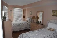 Two bedroom condo with deck overlooking the ocean. Private beach!