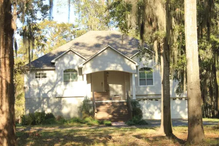 Elegant WATERFRONT home with private boat ramp/dock, elevator, & unmatched view!