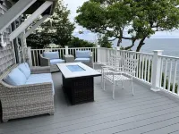 Home with spectacular panoramic ocean views from a bluff high above Cape Cod Bay