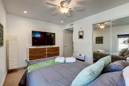 Modern cabin hidden among the trees-- Unwind and relax on the porch creek-side.