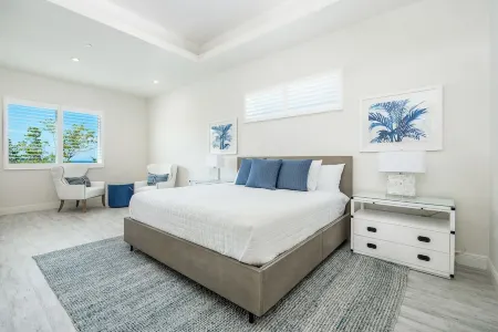 7 Mile Beach Beach Penthouse. Ocean views from Roof Terrace and a Pool Pavilion