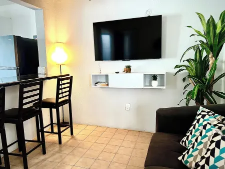 Comfortable modern apartment conveniently located for shopping and dining.