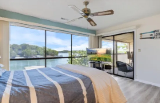 Expansive Views and Community Pool - Stunning Lakefront Oasis