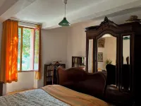 Provençal farm among olive trees; view of the hill from a large shaded terrace
