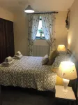 Rustic barn Cottage in a rural village with traditional open fireplace sleeps 5.