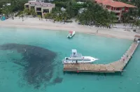 Oceanfront beach house with dual-masters & screened balcony on West Bay Beach
