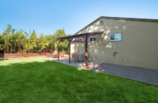 Modern Mid-Century Retreat with Stylish Amenities & Family-Friendly Comfort