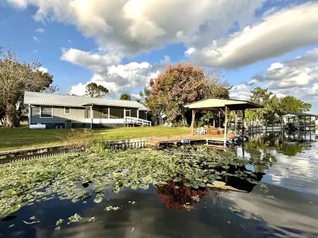 Water view Home with Dock on  Canal with access to Lake!