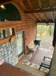 Adventurer's  Lodge, a charming 3-bedroom cabin with WiFi in quiet Lansing, WV.