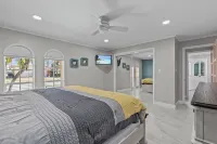 Water Front Home with Heated Pool & Hot Tub, 2 Master Suites & a Floating Dock.