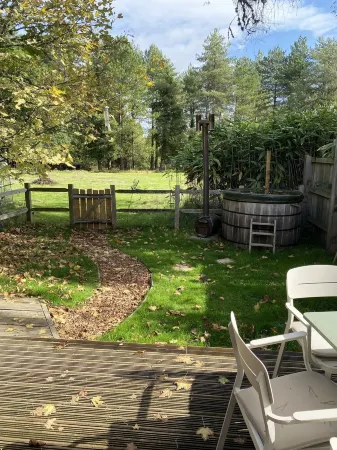 Idyllic Log Cabin with Log-fired Hot Tub nestled in a Forest Clearing