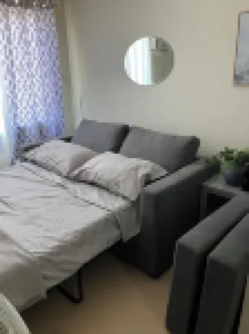 Cozy condo with AC and fitness room in lovely Dumaguete steps from the Ocean