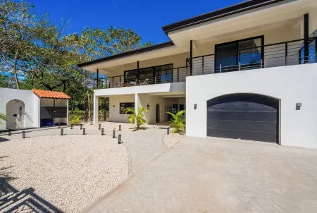 Super lux 5-bedroom, 7 bath house in beautiful Playa Grande with golf cart!