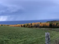 A view of Lake Superior set in the middle of a working farm