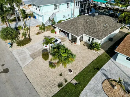 3 Bed 2 Bath on Deep Canal 5 minutes to channel CLEAN & NICE. New boat hoist