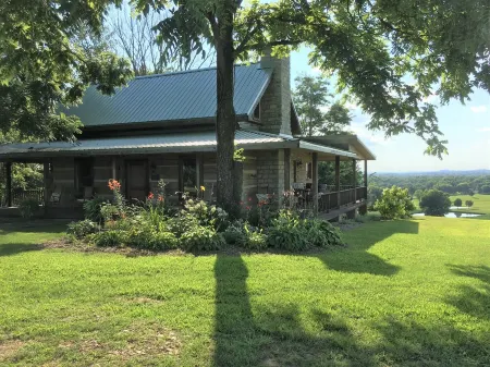 Historic Log Cabin on 200 acre farm, pasture and forest with panoramic views!